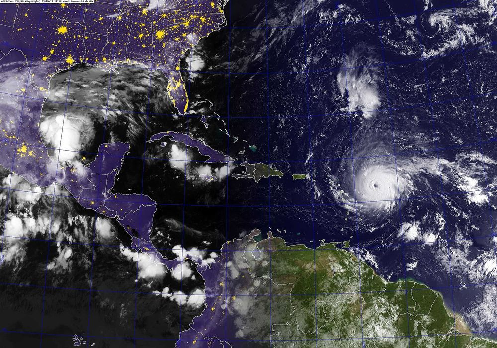Satellite view of a swirling tropical hurricane over open ocean waters.