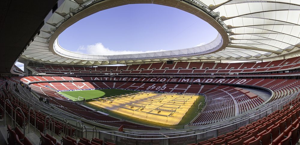 The exterior of the Metropolitano Stadium in Madrid, venue for the 2027 Champions League final, under a clear sky.
