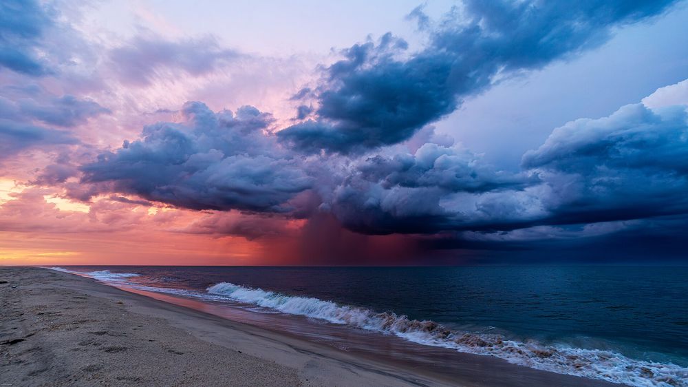 Reds and blues clash in the sky over the Atlantic Ocean off the coast of Delaware. An evening storm passed through just after sunset. I was RV camping in Delaware Seashore State Park at the Indian River Inlet and hopped on my bike to find a spot to watch sunset. During that time, this storm develope